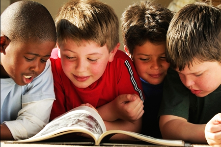 Four Children sharing a book